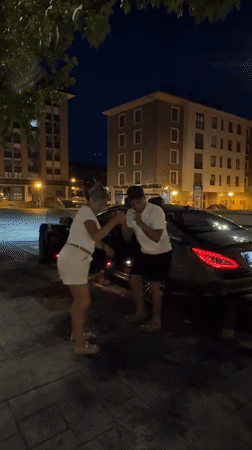 Evening gathering near parked car in Mungia, Spain