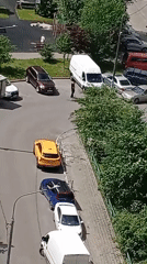 Aerial and street views of parked vehicles in an urban area