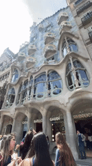 Tourist captures Casa Batlló's iconic Gaudí facade in Barcelona