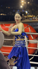 Belly dancer performs evening show aboard tour boat in Vietnam