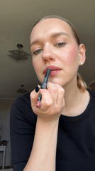 Woman applies makeup, takes selfies in Dreiliņi, Latvia