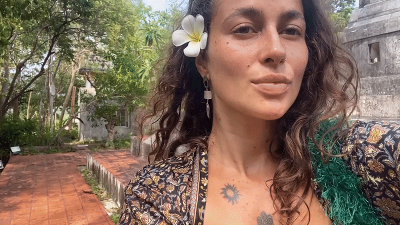 Woman creates floral selfie content at Koh Phangan locations