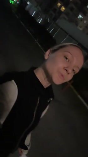 Woman takes nighttime selfies in Esenyurt residential district