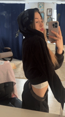 Woman documents personal moments in early morning selfie session