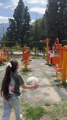 Children play at outdoor recreation facilities in Agarak, Armenia