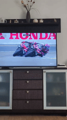 Viewer watches motorcycle race broadcast in Picassent home