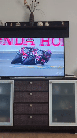 Viewer watches motorcycle race broadcast in Picassent home
