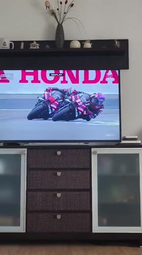 Viewer watches motorcycle race broadcast in Picassent home