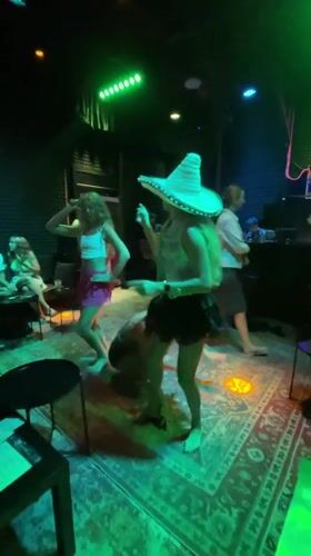Women dance and sing karaoke at Thailand entertainment venue