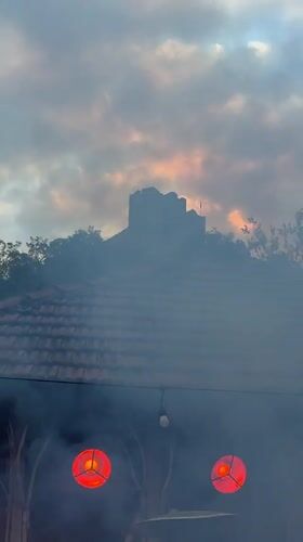 Band performs amid smoke and lights in Maglic, Serbia