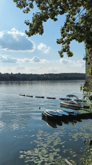 Sunny afternoon at Ternopil Lake's busy waterfront promenade