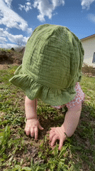 Baby explores yard near house in Фоки, Russia