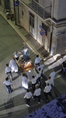 Religious procession with Virgin Mary statue through Barletta streets