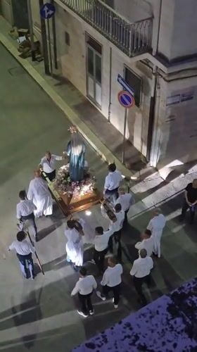 Religious procession with Virgin Mary statue through Barletta streets