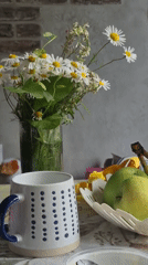 Morning table still life with flowers, fruit, and a drink