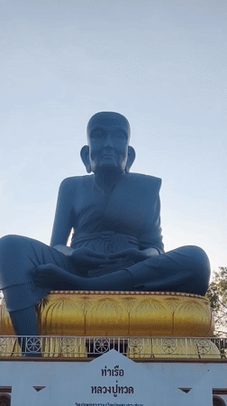 Tourist documents Thai temple statues and grounds in Baan Bo Phut