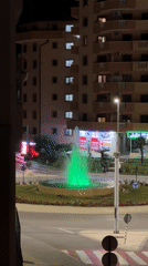 Colorful illuminated fountain cycles through lights at Montenegro roundabout