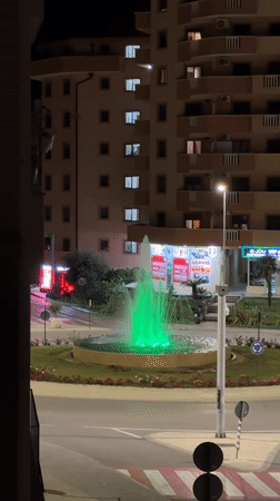 Colorful illuminated fountain cycles through lights at Montenegro roundabout