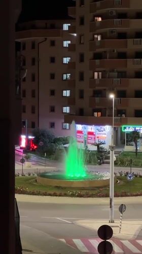 Colorful illuminated fountain cycles through lights at Montenegro roundabout