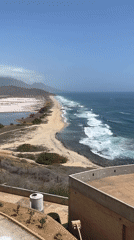 Tourist documents Pampatar coastline featuring pink salt lakes, beaches