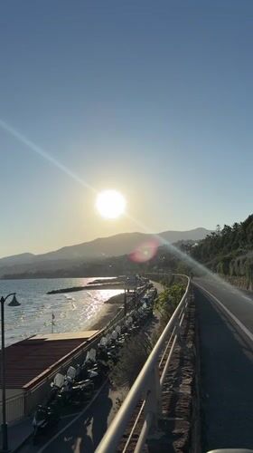Cyclist documents sunny afternoon ride along Sanremo coastal path