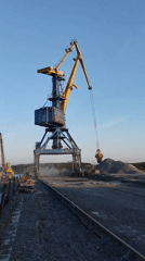 Harbor cranes and docked ship observed at Tver port