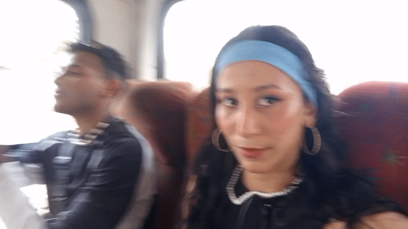 Bus passengers share smiles during evening commute in Porlamar