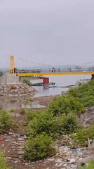 Two people spotted on yellow suspension bridge in Lhokseumawe