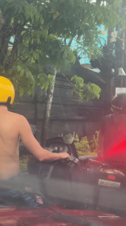 Shirtless motorcyclist spotted on North Kuta street
