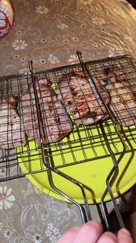 Backyard barbecue with grilled meat and beer in Udelnaya