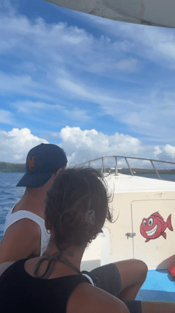 Two people travel by small boat near Nusa Penida