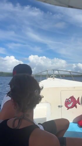 Two people travel by small boat near Nusa Penida