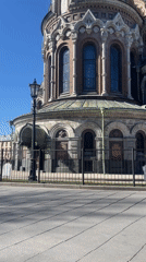 Tourist documents iconic Saint Petersburg church and surrounding architecture