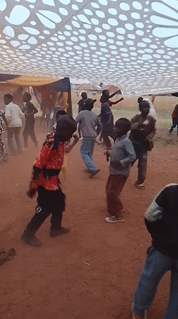 Children dance at community celebration in Kuru Karama, Nigeria