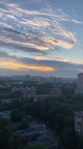 Khimki at golden hour: streets, skyline, and a golden-domed church