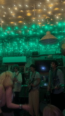 Three-piece band performs at London bar venue