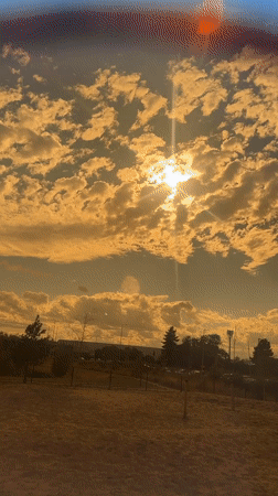 Golden hour at a Milton Keynes playground, swings and summer sky