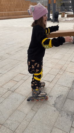 Young girl rollerblading in Yekaterinburg public square