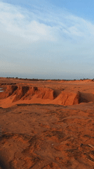 Desert landscape with eroded terrain documented in Mui Ne