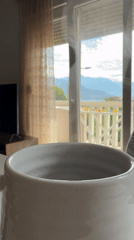 Morning coffee moment captured with mountain view in Bijela