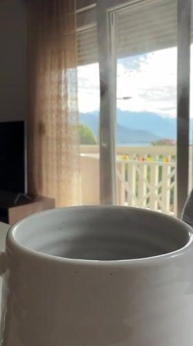 Morning coffee moment captured with mountain view in Bijela