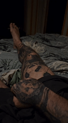 Tattooed man filmed resting on bed in Stara Zagora