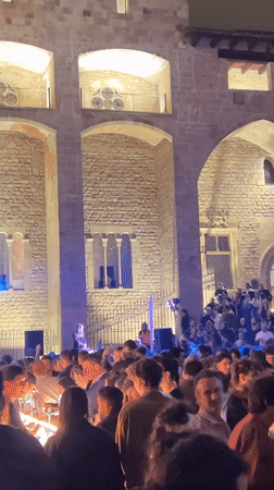Female DJ draws large nighttime crowd to Barcelona courtyard concert