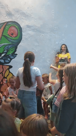 Kids dancing, bubble-chasing, and playing arcade games in Nesebar