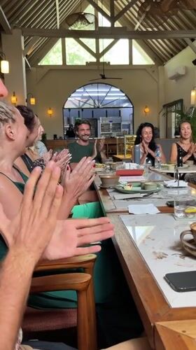 Group brunch at a sunlit Ubud café with coffee and company