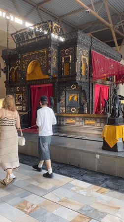 Visitors tour Yekaterinburg Museum of Fine Arts viewing paintings and artifacts