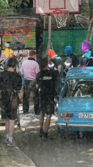 Film crew shoots outdoor production with masked performers