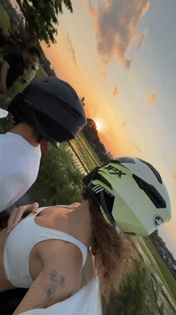 Motorcycle riders document sunset journey through North Kuta rice paddies