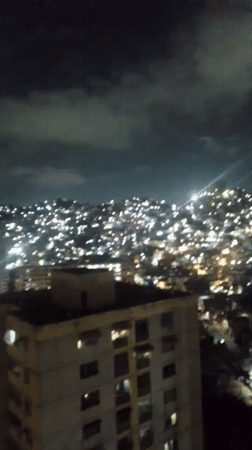 Late-night Caracas scenes captured including cityscape and young child
