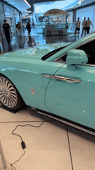 Teal Rolls-Royce on display inside a Tashkent shopping mall